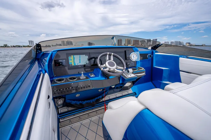 Slide: The Image of 2024 Nor-Tech 360 Monte Carlo Flyer cockpit with modern controls and blue interior. - 5