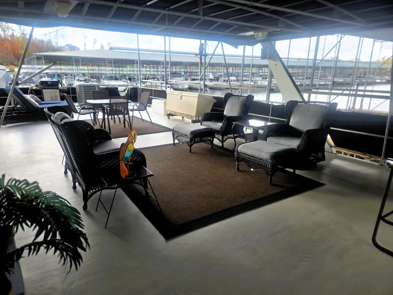Slide: The Image of Spacious deck of 1996 Sumerset 82'x18' houseboat with comfortable seating and marina view. - 7