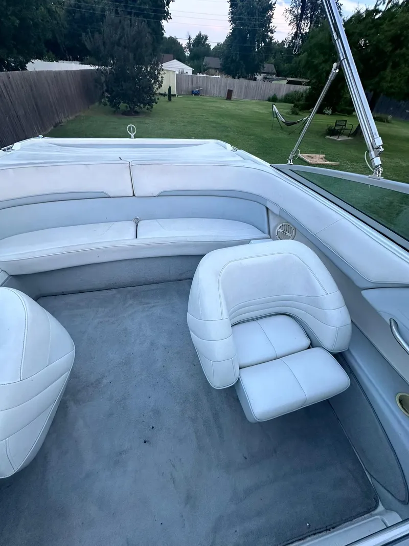 Slide: The Image of 1998 Cobalt 252 boat interior with white seating and spacious layout. - 7