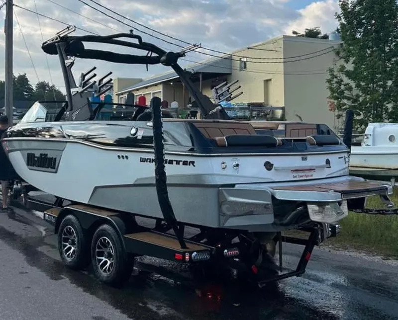 Slide: The Image of 2022 Malibu Wakesetter 23 LSV boat on trailer, parked outdoors. - 3