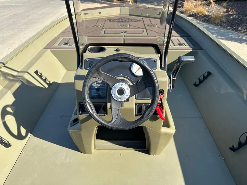 Slide: The Image of 2025 Tracker Grizzly 2072 CC boat console with steering wheel and gauges. - 4