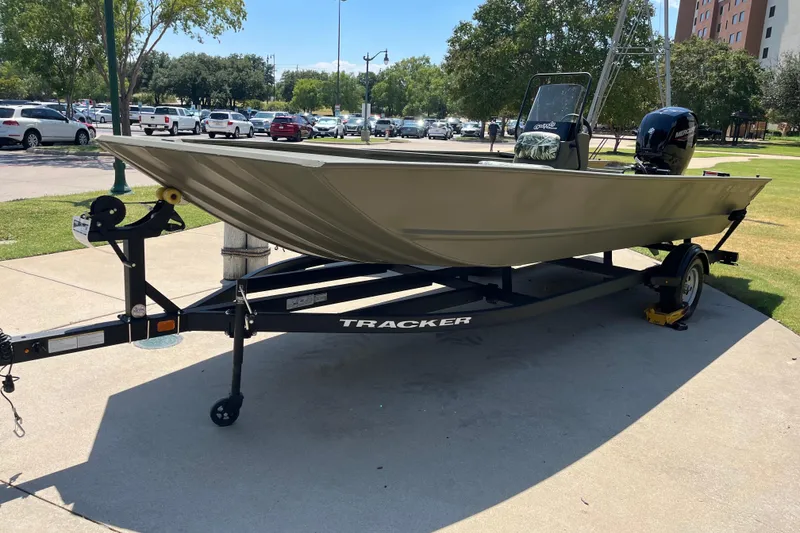 The Image of 2025 Tracker Grizzly 2072 CC boat on trailer in outdoor parking area. - 0