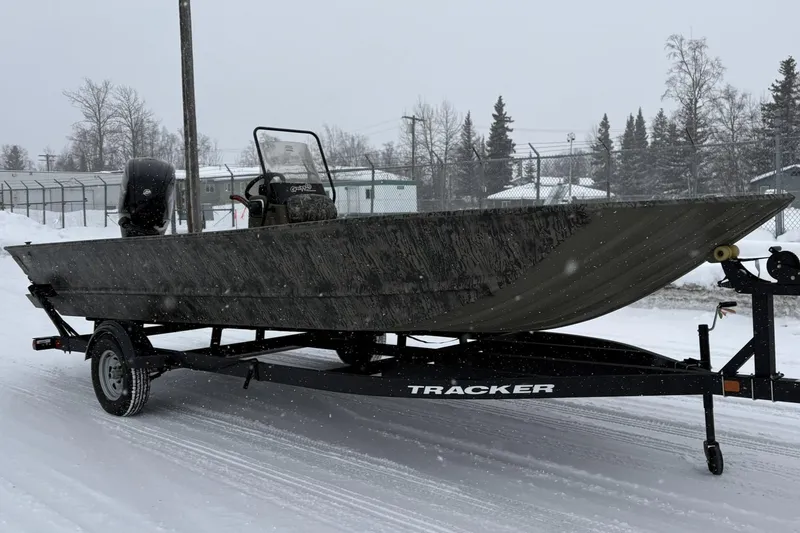 The Image of 2025 Tracker Grizzly 2072 CC boat on trailer in snowy landscape. - 0