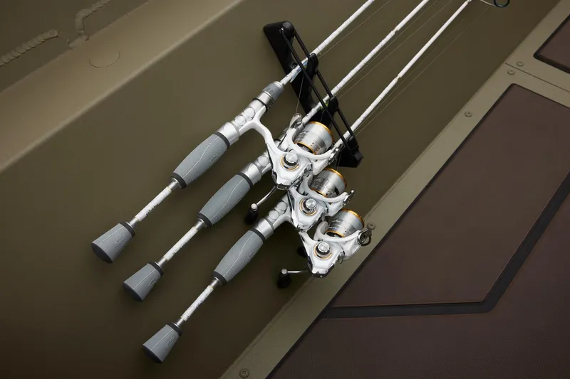 Slide: The Image of Fishing rods on 2025 Tracker Grizzly 2072 CC boat deck, neatly arranged and secured. - 39