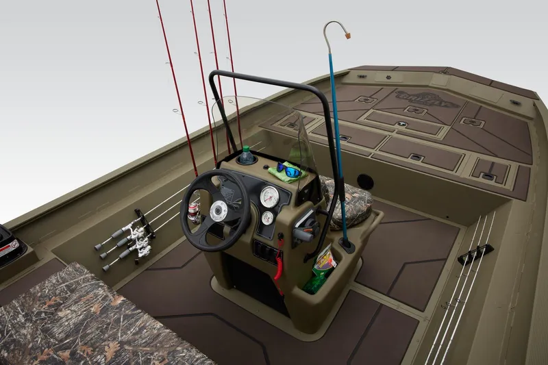 Slide: The Image of 2025 Tracker Grizzly 2072 CC boat interior with fishing rods and steering console. - 41
