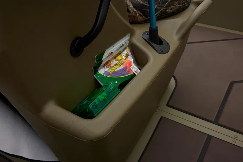 Slide: The Image of Storage compartment in 2025 Tracker Grizzly 2072 CC boat with fishing gear. - 46