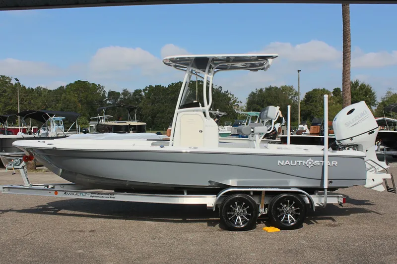 The Image of 2025 NauticStar 224 Bay boat on trailer, side view. - 0