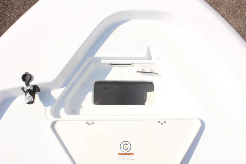 Slide: The Image of 2025 NauticStar 224 Bay boat deck with storage compartment. - 27