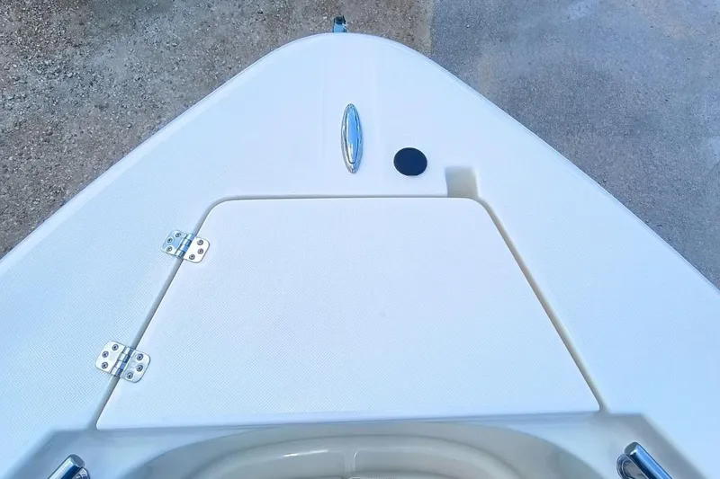 Slide: The Image of Bow view of 2025 Bulls Bay 230 Center Console boat, featuring sleek design and storage hatch. - 33