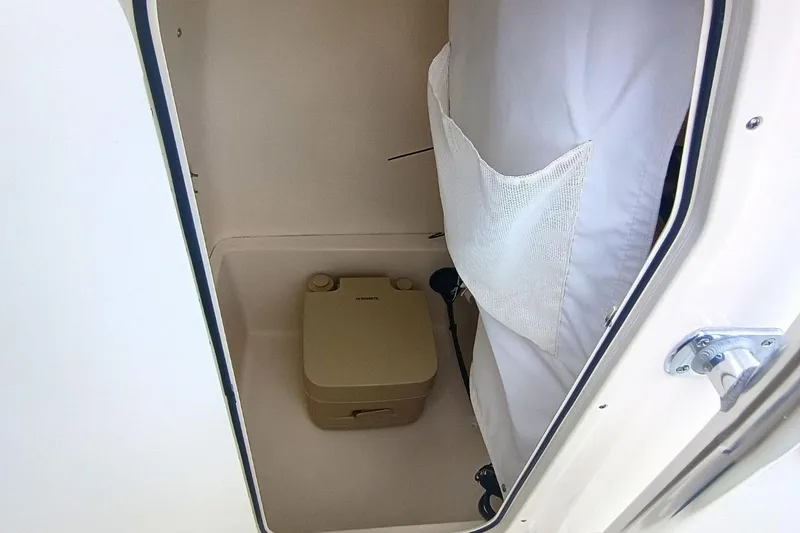 Slide: The Image of Interior of 2025 Bulls Bay 230 Center Console boat with portable toilet. - 28
