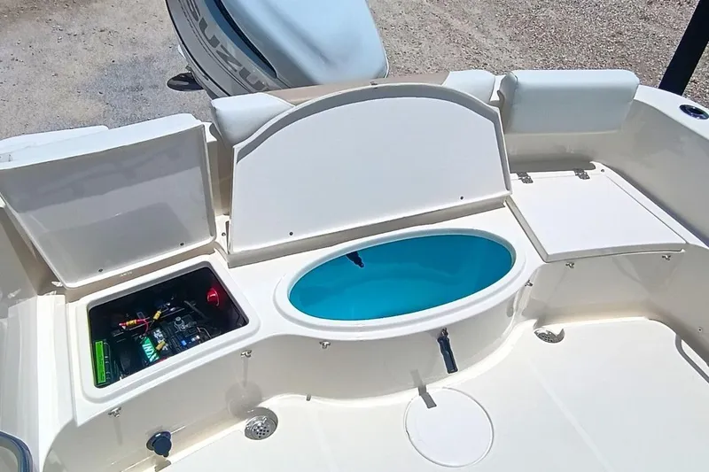 Slide: The Image of 2025 Bulls Bay 230 Center Console boat interior with storage compartments and livewell. - 50