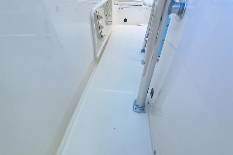 Slide: The Image of 2025 Bulls Bay 230 Center Console boat interior with sleek white deck design. - 43