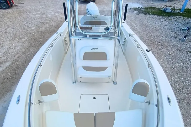 Slide: The Image of 2025 Bulls Bay 230 Center Console boat interior with seating and console view. - 36