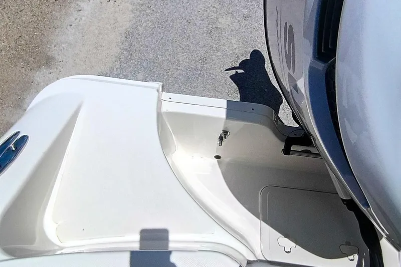 Slide: The Image of 2025 Bulls Bay 230 Center Console boat detail with engine and deck view. - 53