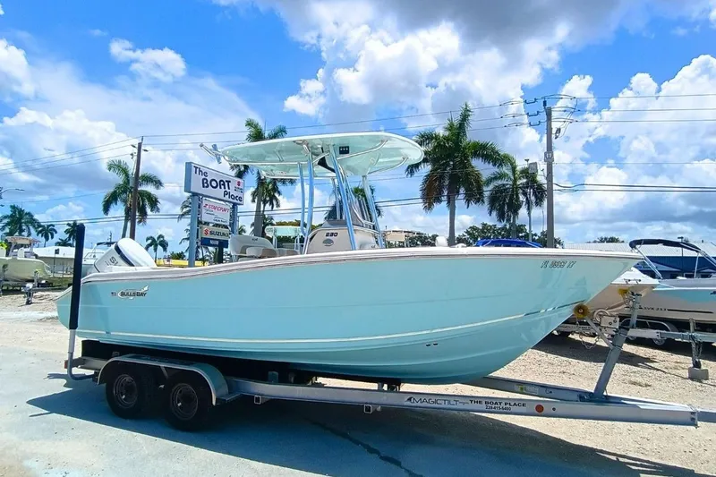 The Image of 2025 Bulls Bay 230 Center Console boat on trailer, displayed outdoors under a sunny sky. - 0