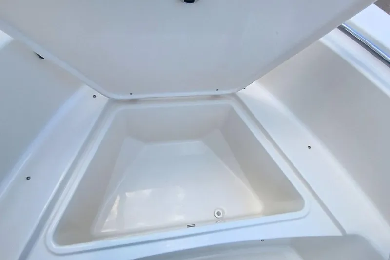 Slide: The Image of Open storage compartment on 2025 Bulls Bay 230 Center Console boat. - 40