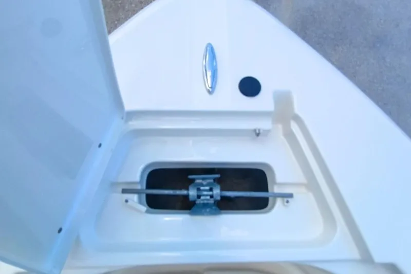 Slide: The Image of 2025 Bulls Bay 230 Center Console anchor compartment, open lid, white finish. - 34