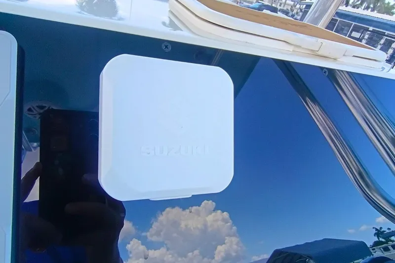 Slide: The Image of 2025 Bulls Bay 230 Center Console with Suzuki component, reflecting blue sky and clouds. - 17