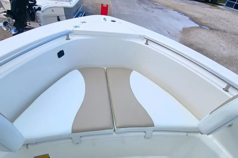 Slide: The Image of 2025 Bulls Bay 230 Center Console boat with cushioned seating area. - 32