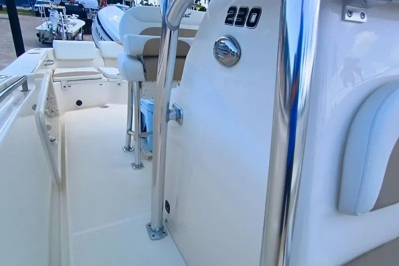 Slide: The Image of 2025 Bulls Bay 230 Center Console boat interior with seating and console details. - 42