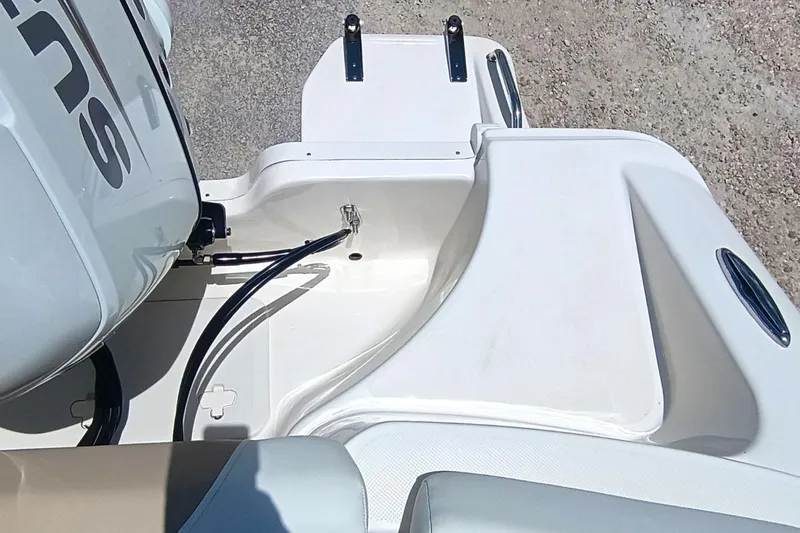 Slide: The Image of 2025 Bulls Bay 230 Center Console boat engine area, featuring sleek design and modern fittings. - 54