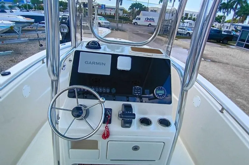 Slide: The Image of 2025 Bulls Bay 230 Center Console boat dashboard with Garmin navigation system. - 14