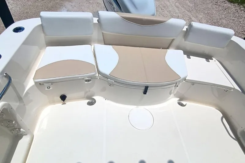 Slide: The Image of 2025 Bulls Bay 230 Center Console boat seating area with beige and white cushions. - 48