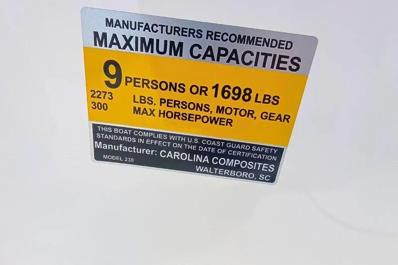 Slide: The Image of 2025 Bulls Bay 230 Center Console boat capacity label, 9 persons or 1698 lbs, 300 max horsepower. - 47