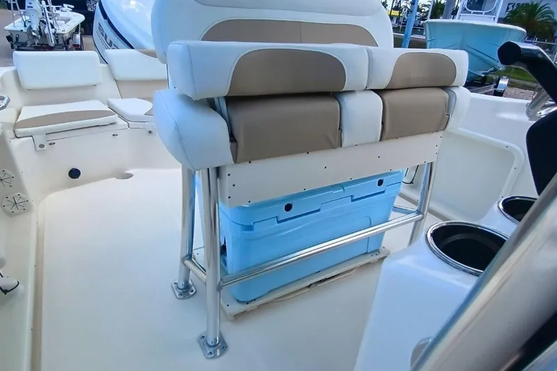 Slide: The Image of 2025 Bulls Bay 230 Center Console boat interior with cushioned seating and storage. - 44