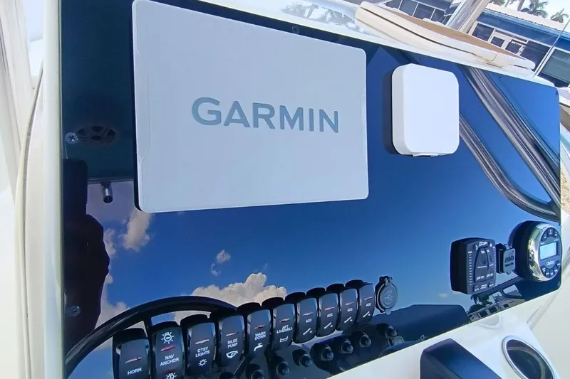 Slide: The Image of 2025 Bulls Bay 230 Center Console dashboard with Garmin navigation system. - 15