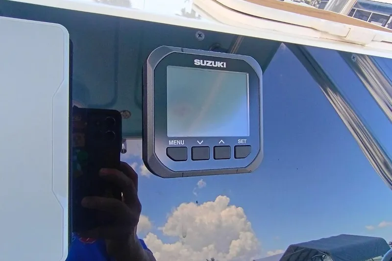 Slide: The Image of Close-up of Suzuki display on 2025 Bulls Bay 230 Center Console boat. - 18