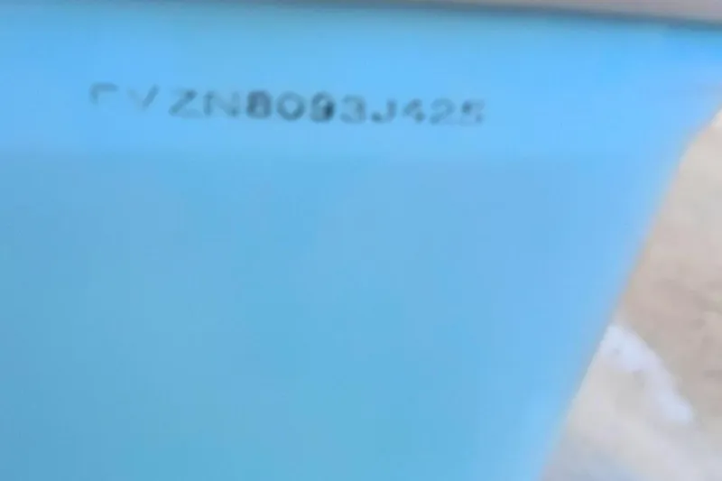 Slide: The Image of 2025 Bulls Bay 230 Center Console boat hull identification number. - 55