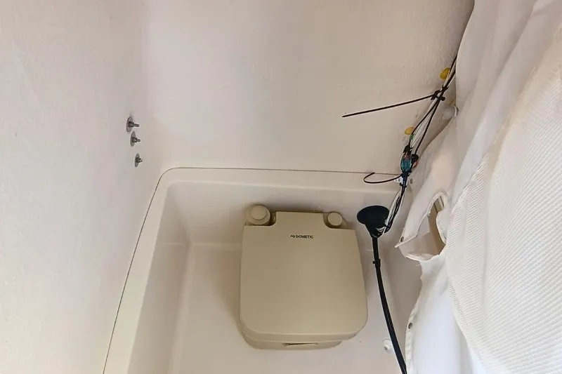 Slide: The Image of Portable toilet in 2025 Bulls Bay 230 Center Console boat interior. - 30