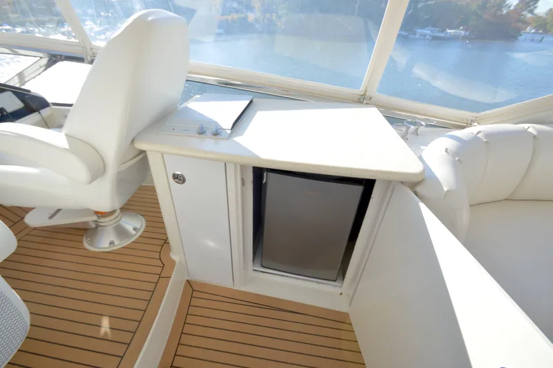 Slide: The Image of Luxurious interior of 2007 Marquis 59 yacht with seating and mini fridge. - 19