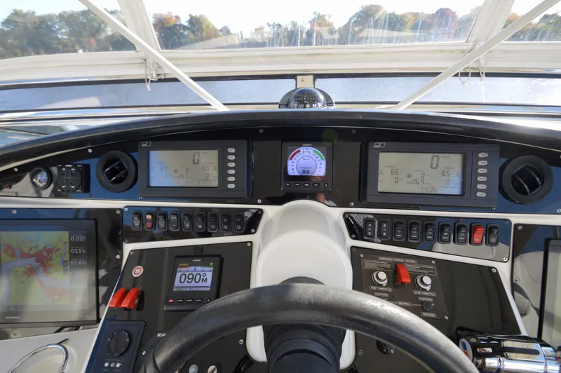 Slide: The Image of Dashboard of a 2007 Marquis 59 yacht with navigation and control instruments. - 22