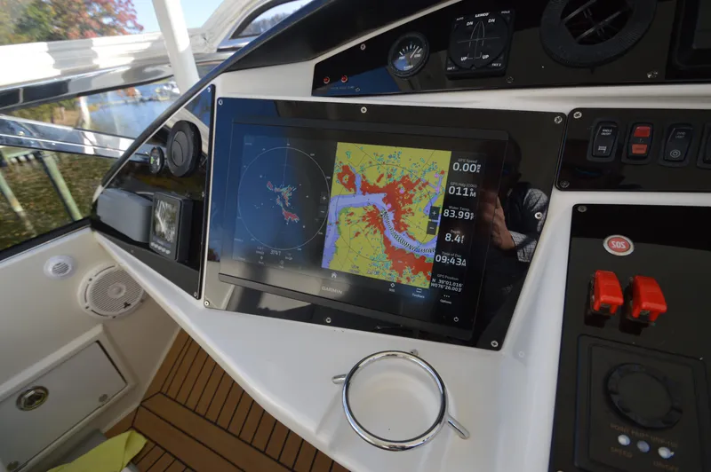 Slide: The Image of Boat dashboard with navigation system on a 2007 Marquis 59 yacht. - 24