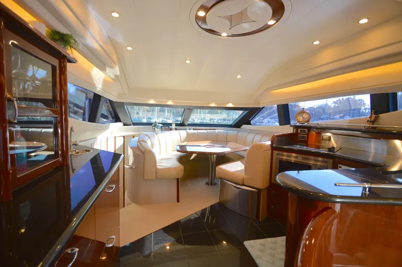 Slide: The Image of Luxurious interior of a 2007 Marquis 59 yacht with elegant seating and modern amenities. - 33