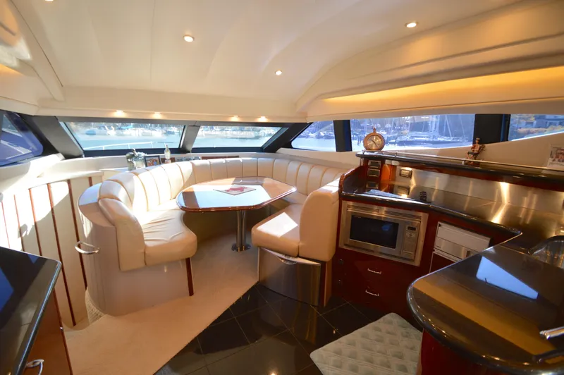 Slide: The Image of Luxurious interior of a 2007 Marquis 59 yacht with plush seating and modern amenities. - 34