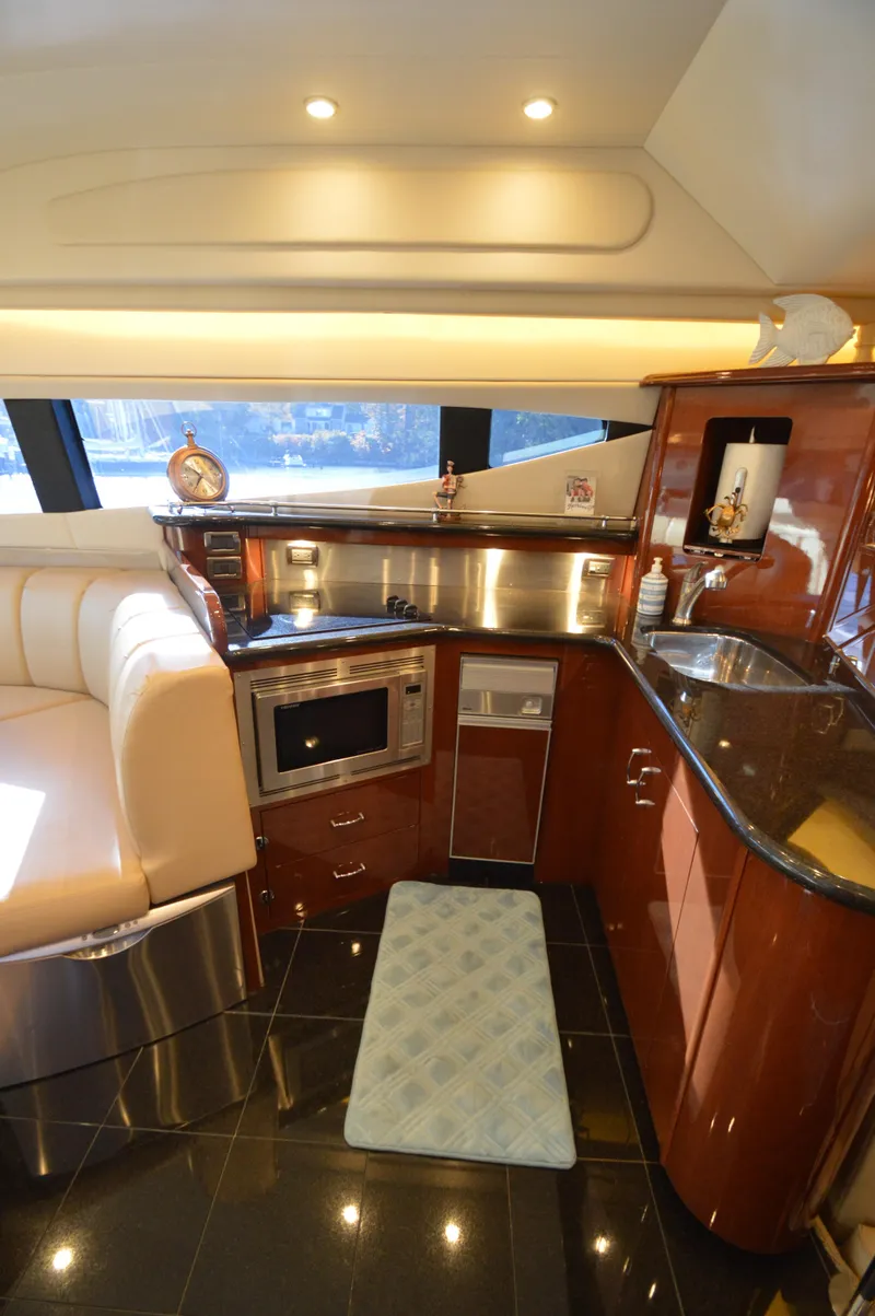 Slide: The Image of Luxurious 2007 Marquis 59 yacht interior with modern kitchen and elegant design. - 36