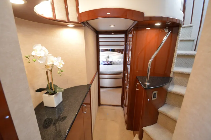 Slide: The Image of Luxurious interior of 2007 Marquis 59 yacht with elegant staircase and floral decor. - 41