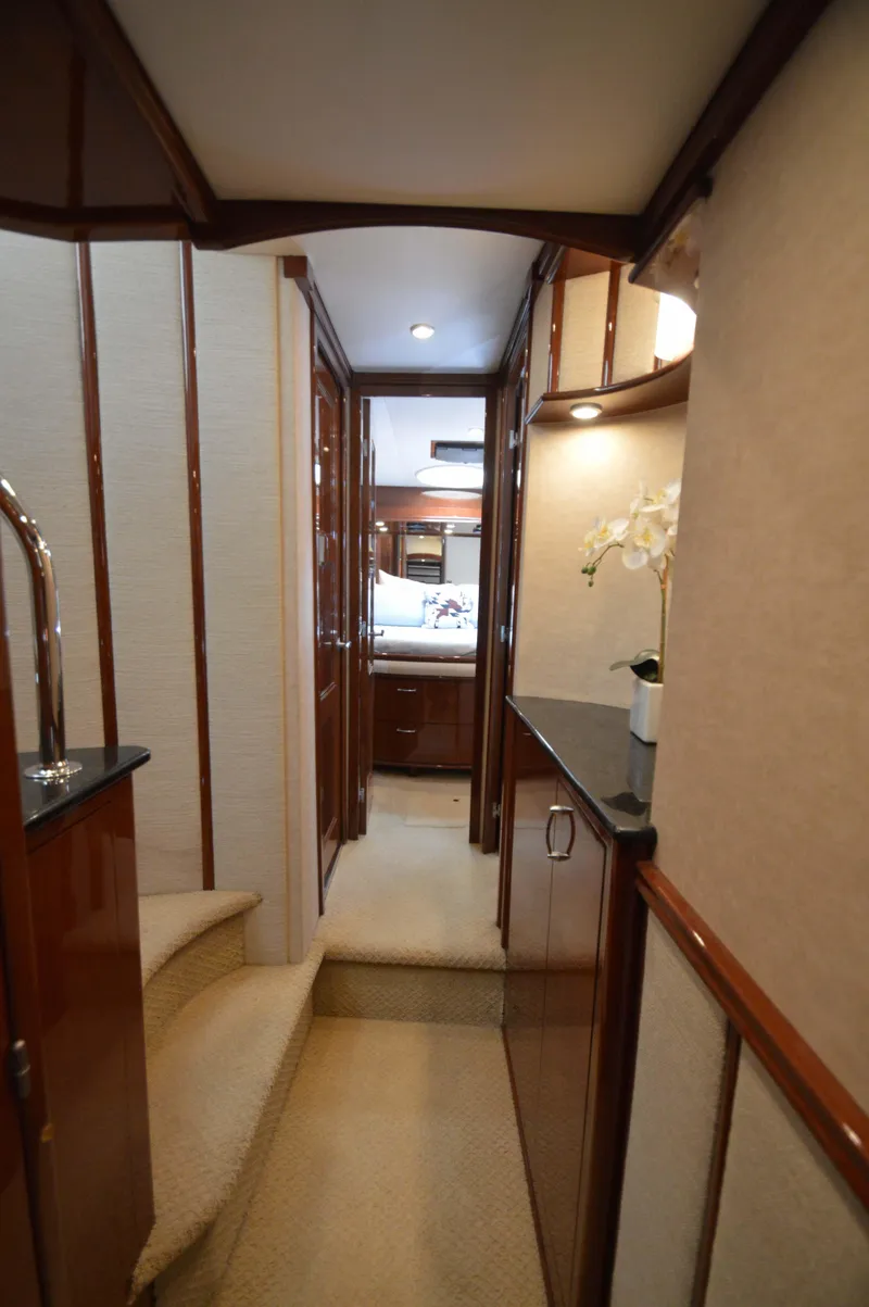 Slide: The Image of Luxurious interior hallway of 2007 Marquis 59 yacht with elegant wood finishes. - 42