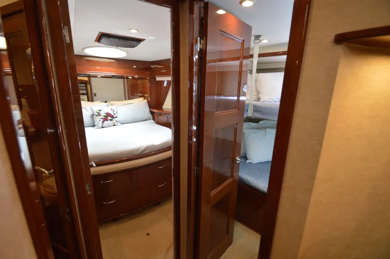 Slide: The Image of Luxurious 2007 Marquis 59 yacht interior with cozy bedroom and bunk beds. - 44