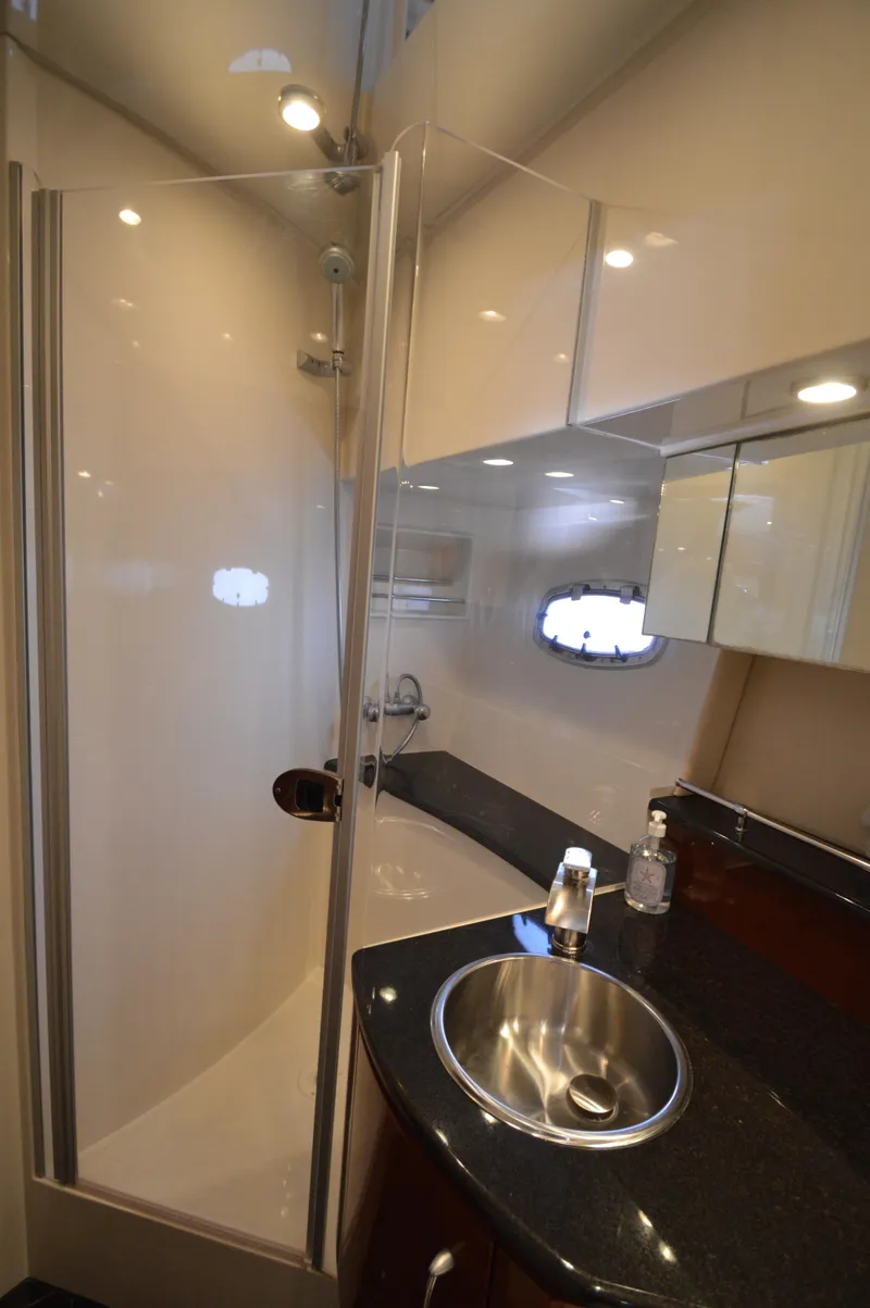 Slide: The Image of Luxurious bathroom in 2007 Marquis 59 yacht with modern fixtures and sleek design. - 47