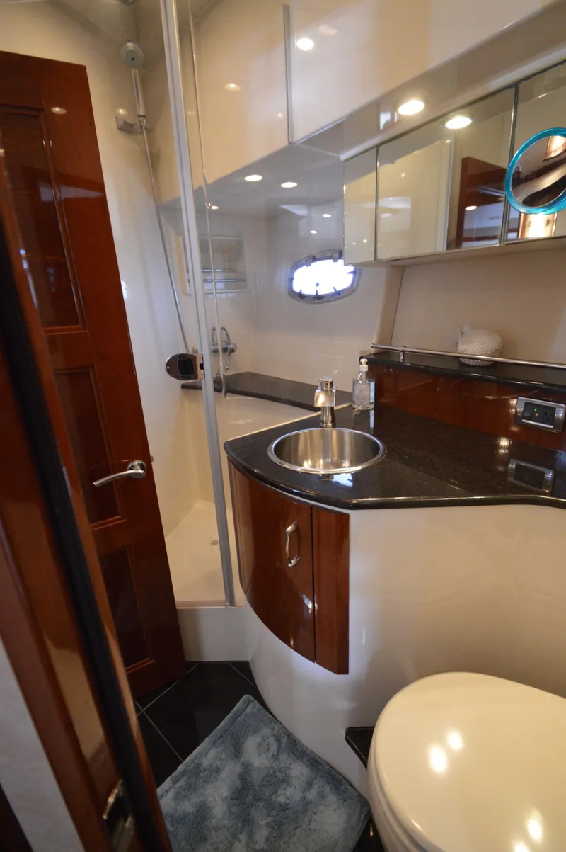 Slide: The Image of Luxurious 2007 Marquis 59 yacht bathroom with modern fixtures and elegant design. - 48