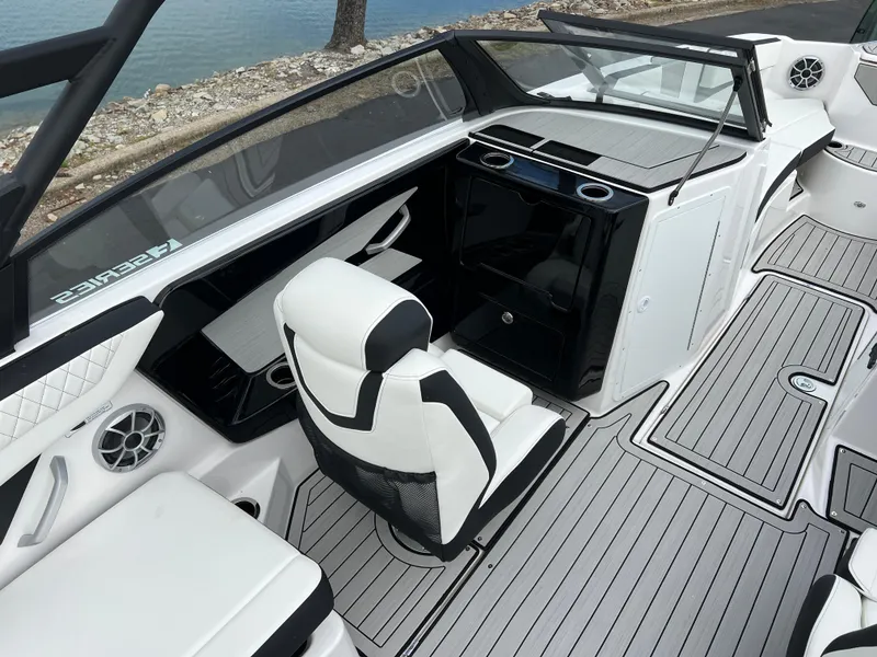 Slide: The Image of 2025 Yamaha Boats 222SE interior with sleek seating and modern dashboard design. - 10