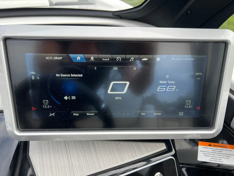 Slide: The Image of Dashboard display of 2025 Yamaha Boats 222SE showing speed, water temperature, and audio settings. - 13