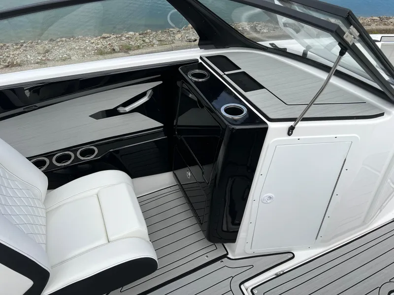 Slide: The Image of 2025 Yamaha Boats 222SE interior with sleek seating and modern dashboard design. - 14