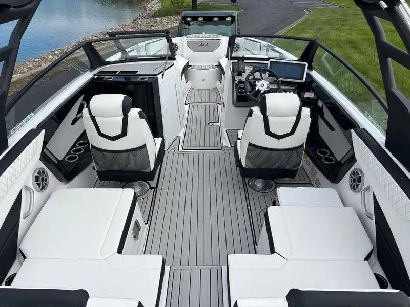 Slide: The Image of 2025 Yamaha Boats 222SE interior with sleek seating and modern dashboard design. - 9