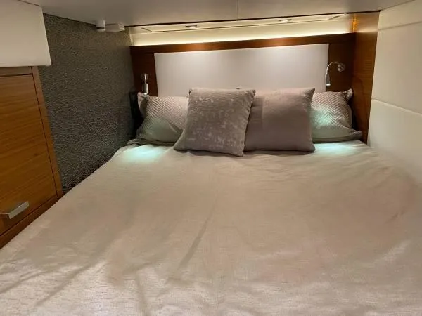 Slide: The Image of Luxurious bedroom interior of 2019 Tiara Sport 39 yacht with elegant bedding. - 10