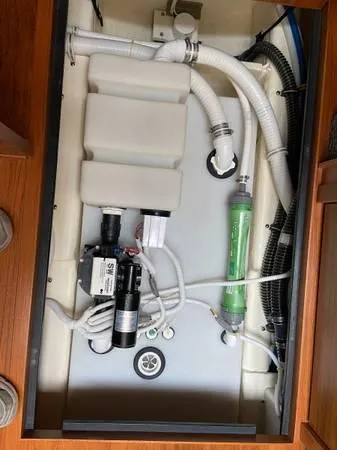 Slide: The Image of 2019 Tiara Sport 39 boat plumbing system with pipes and pump components. - 13